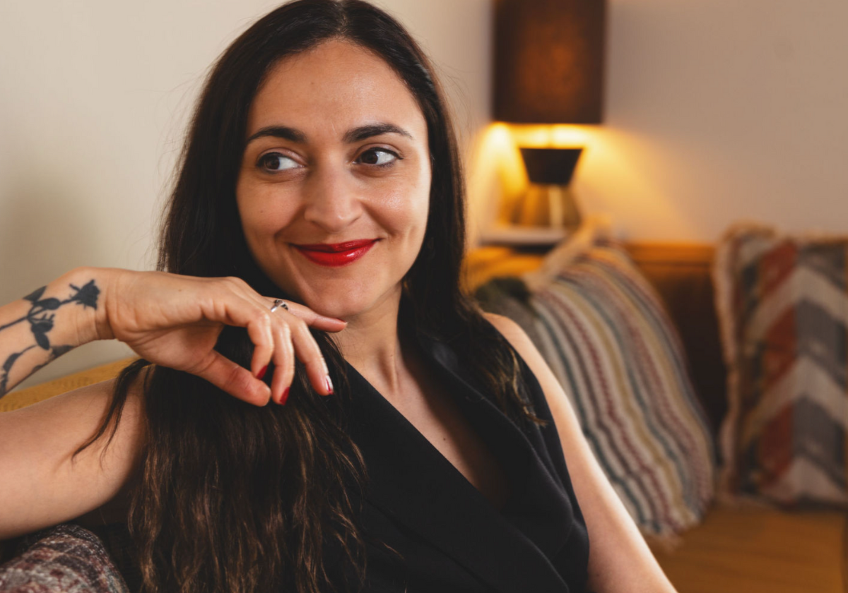 Headshot of a journalist smiling